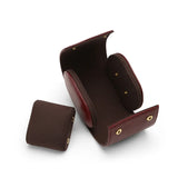 the inside of the watch storage cases and one cushion beside 