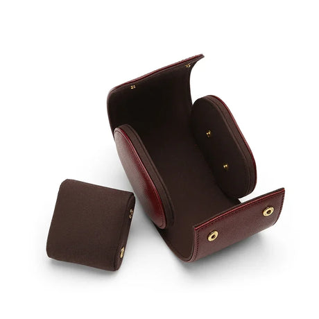 the inside of the watch storage cases and one cushion beside 