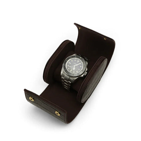 Watch in a brown leather display case on a white background