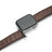 Smartwatch with a brown leather strap on a white background