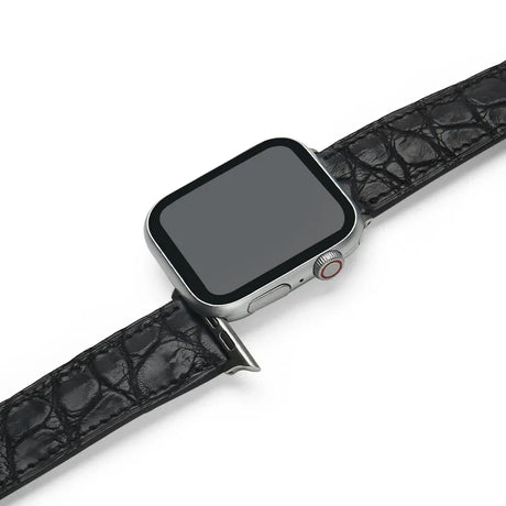 Smartwatch with a black aligator leather strap on a white background