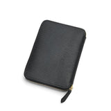 Black lizard pattern leather passport wallet on a white background