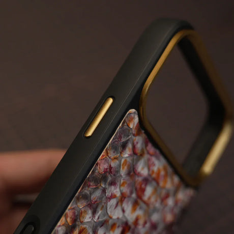 Detail shot of Gold Button on the phone case