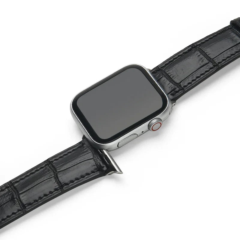 Smartwatch with a black aligator leather watch strap on a white background