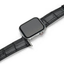 Smartwatch with a black aligator leather watch strap on a white background