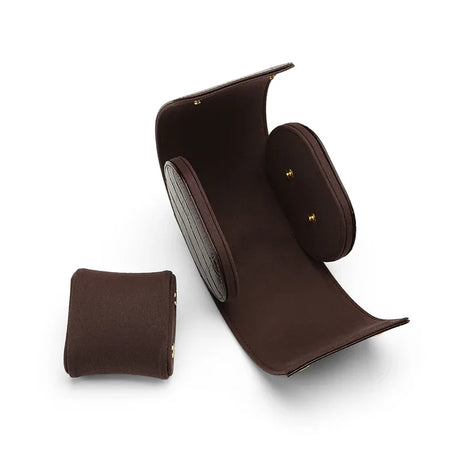 Handcrafted opened aligator pattern leather travel watch roll case with internal suede pillow and gold snaps.
