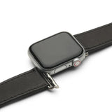 Smartwatch with a black leather strap on a white background