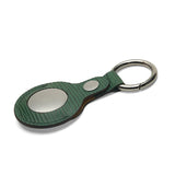 Green textured leather keychain with silver metal ring and oval plate, luxury accessory