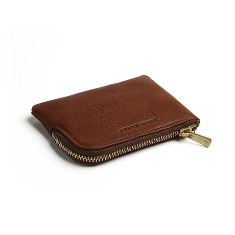 Brown leather coin pouch with a gold zipper on a white background