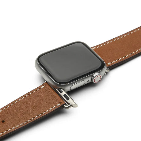 Smartwatch with a brown leather watch strap on a white background
