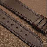 Macro texture of Italian Badalassi Minerva Liscio smooth leather watch band showing precision machine stitching   