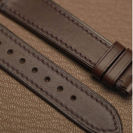 Macro texture of Italian Badalassi Minerva Liscio smooth leather watch band showing precision machine stitching   