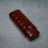 Luxury crocodile-embossed leather cigar case with secure strap, ideal for premium tobacco accessories.