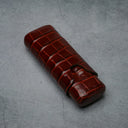 Luxury crocodile-embossed leather cigar case with secure strap, ideal for premium tobacco accessories.