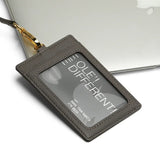 Gray badge holder with 'OLE' DIFFERENT' text on a white background