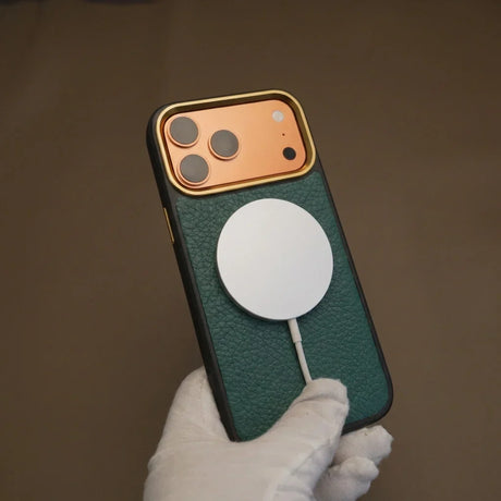 iPhone case with wireless charging magsafe by a gloved hand against a brown background