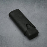 Black textured leather eyeglass case on concrete surface, luxury accessory for men