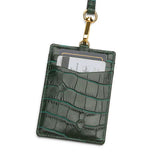 Green crocodile-patterned leather ID badge holder with a lanyard on a white background