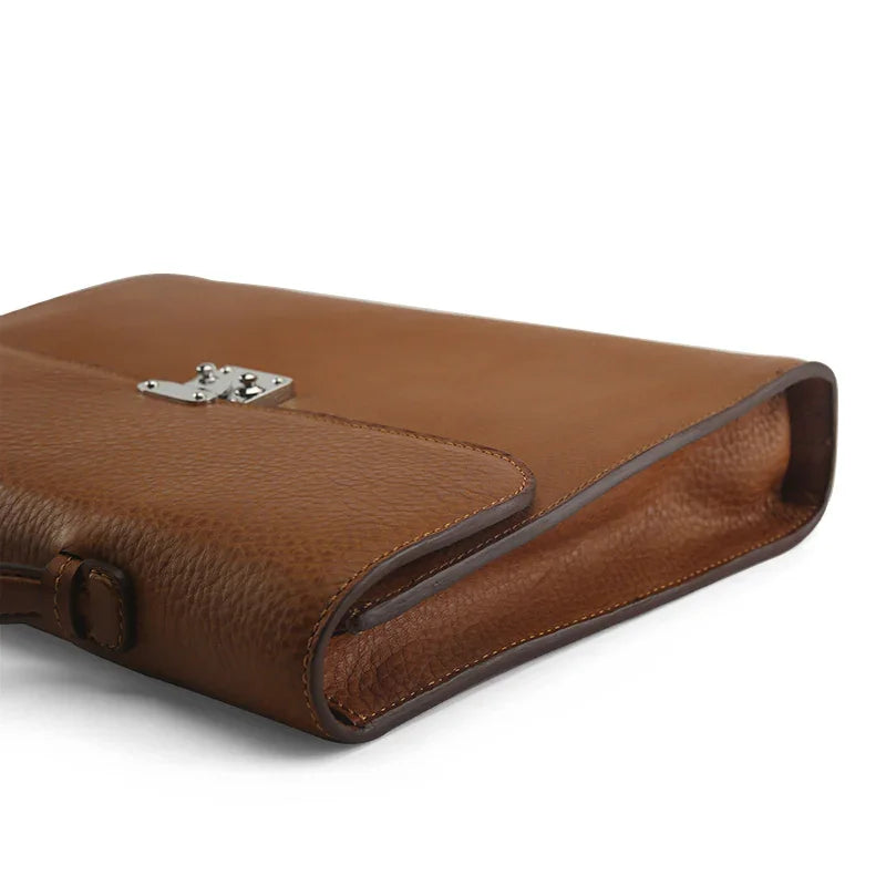 close-up of the painting oil edge of the brown leather tablet briefcases