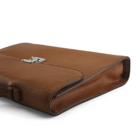 close-up of the painting oil edge of the brown leather tablet briefcases