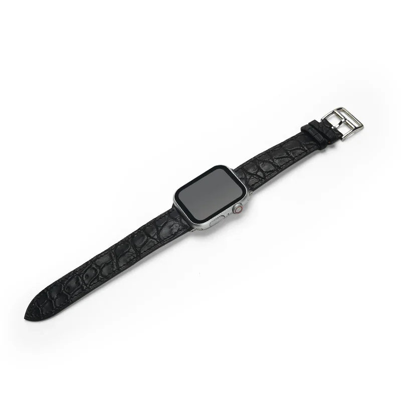 Black aligator watch strap on a white background