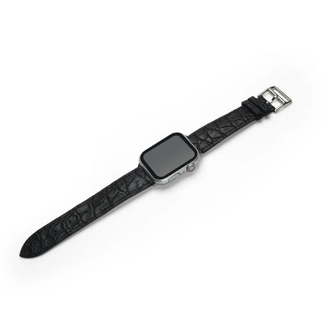 Black aligator watch strap on a white background