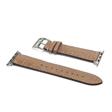 Crocodile Skin Poussier watch strap with silver buckle on a white background