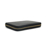 close-up of the gold zipper for the black leather passport wallet
