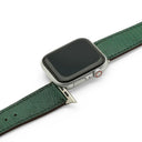 Smartwatch with a green lizard skin leather watch strap on a white background