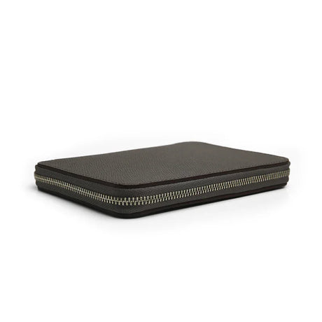 the detail of the zipper for the grey epsom leather passport wallet on a white background