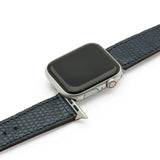 Smartwatch with blue lizard skin watch strap on a white background