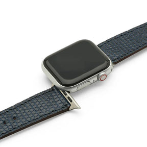 Smartwatch with blue lizard skin watch strap on a white background