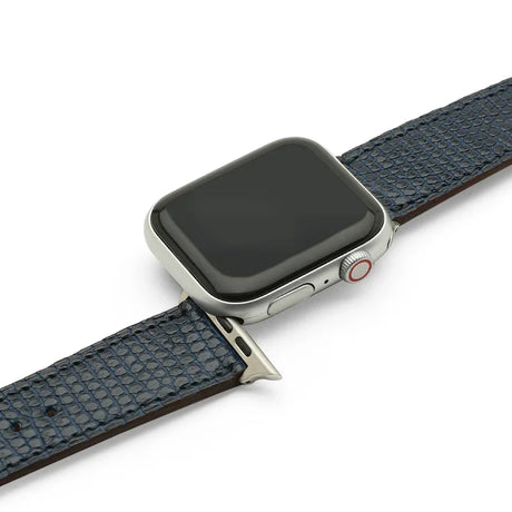 Smartwatch with blue lizard skin watch strap on a white background