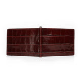 Outisde look of burgundy crocodile skin money clip wallet on a white background