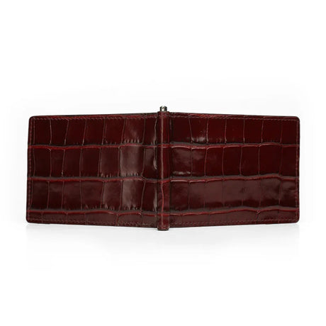 Outisde look of burgundy crocodile skin money clip wallet on a white background