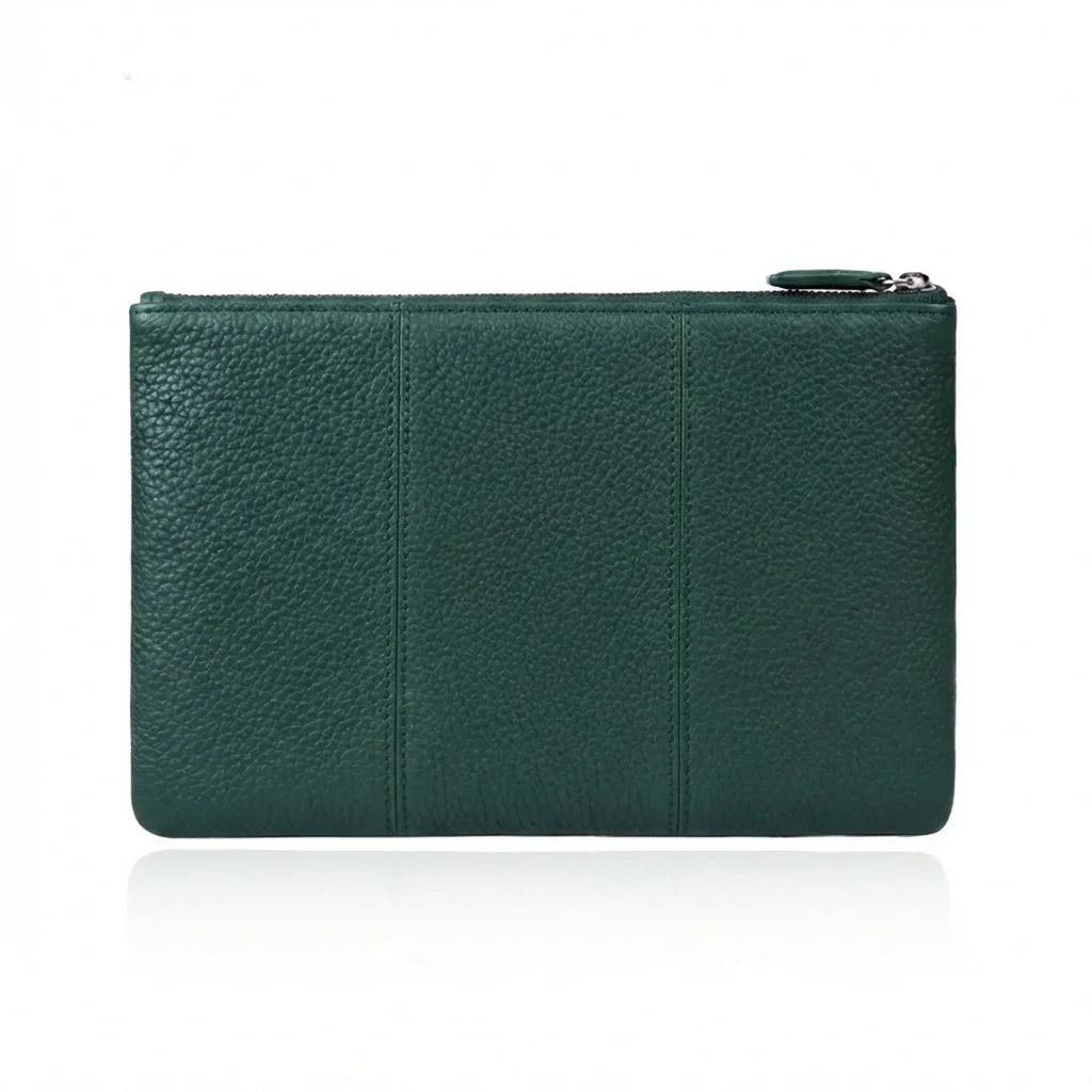 Emerald green pebbled leather clutch with zipper closure, minimalist design for everyday use