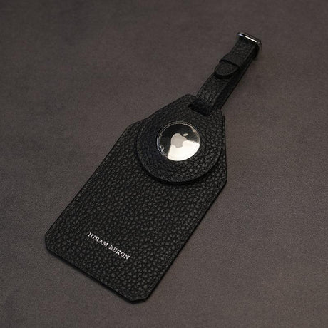 Black pebble leather airtag luggage tag on a gray background