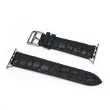 Black genuine aligator leather watch strap with silver buckle on a white background