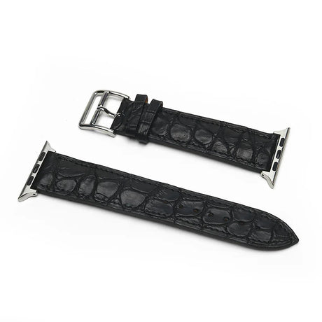 Black genuine aligator leather watch strap with silver buckle on a white background
