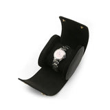 Black watch roll case display stand with a silver watch on a white background