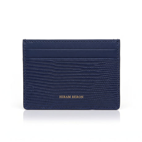 Navy blue lizard pattern leather cardholder on a white background