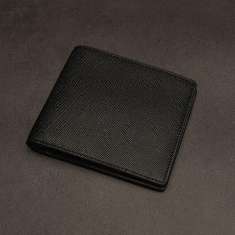 Black saffiano leather wallet on a dark grey background
