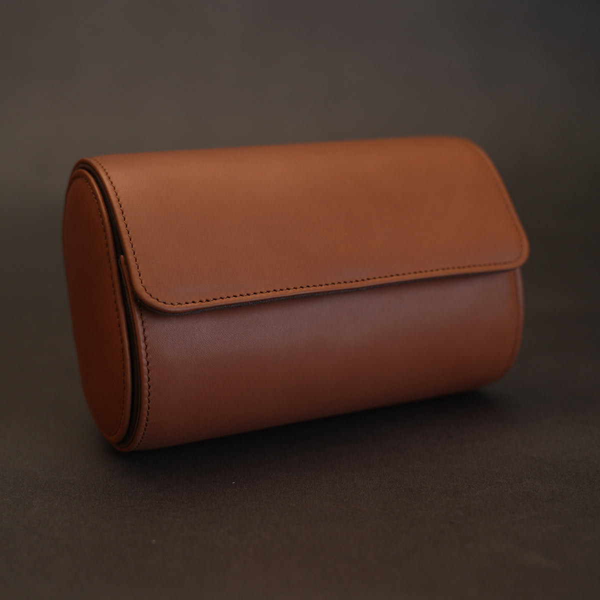 Italian calfskin leather watch roll for 2 watches in brown, dark grey textured background