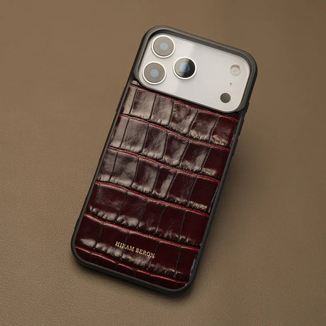 iPhone case with burgundy Italian crocodile pattern on a beige background
