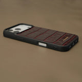 Close-up of edge of burngundy iphone 17 pro case