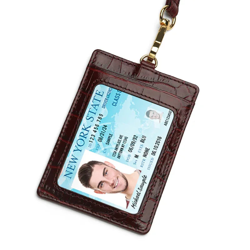 burgundy ID holder with a New York State driver's license on a white background