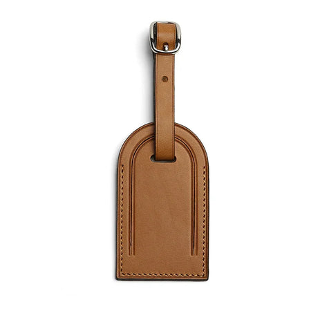 tan leather luggage tag on a white background