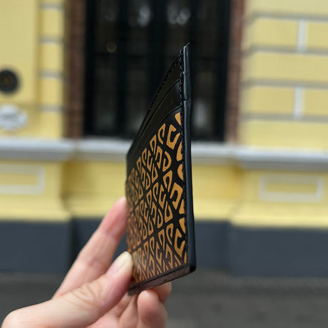 close-up of the edge of the patterned leather card holder