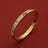 Gold bangle with colorful enamel pattern, luxury accessory for women, elegant wristwear design