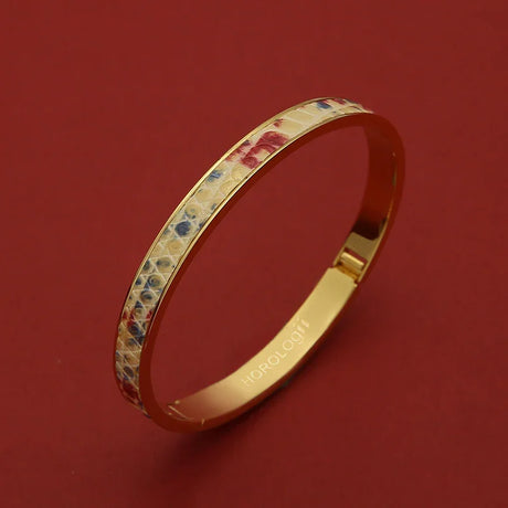 Gold bangle with colorful enamel pattern, luxury accessory for women, elegant wristwear design